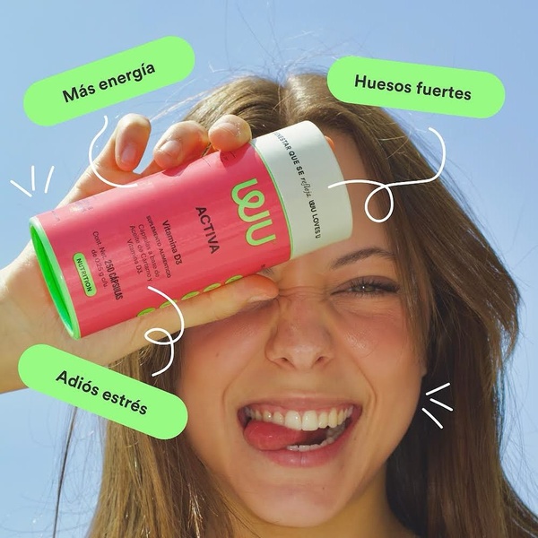 A close-up shot of a person holding a supplement container with dynamic text overlays highlighting key health benefits like energy, stress relief, and bone health.